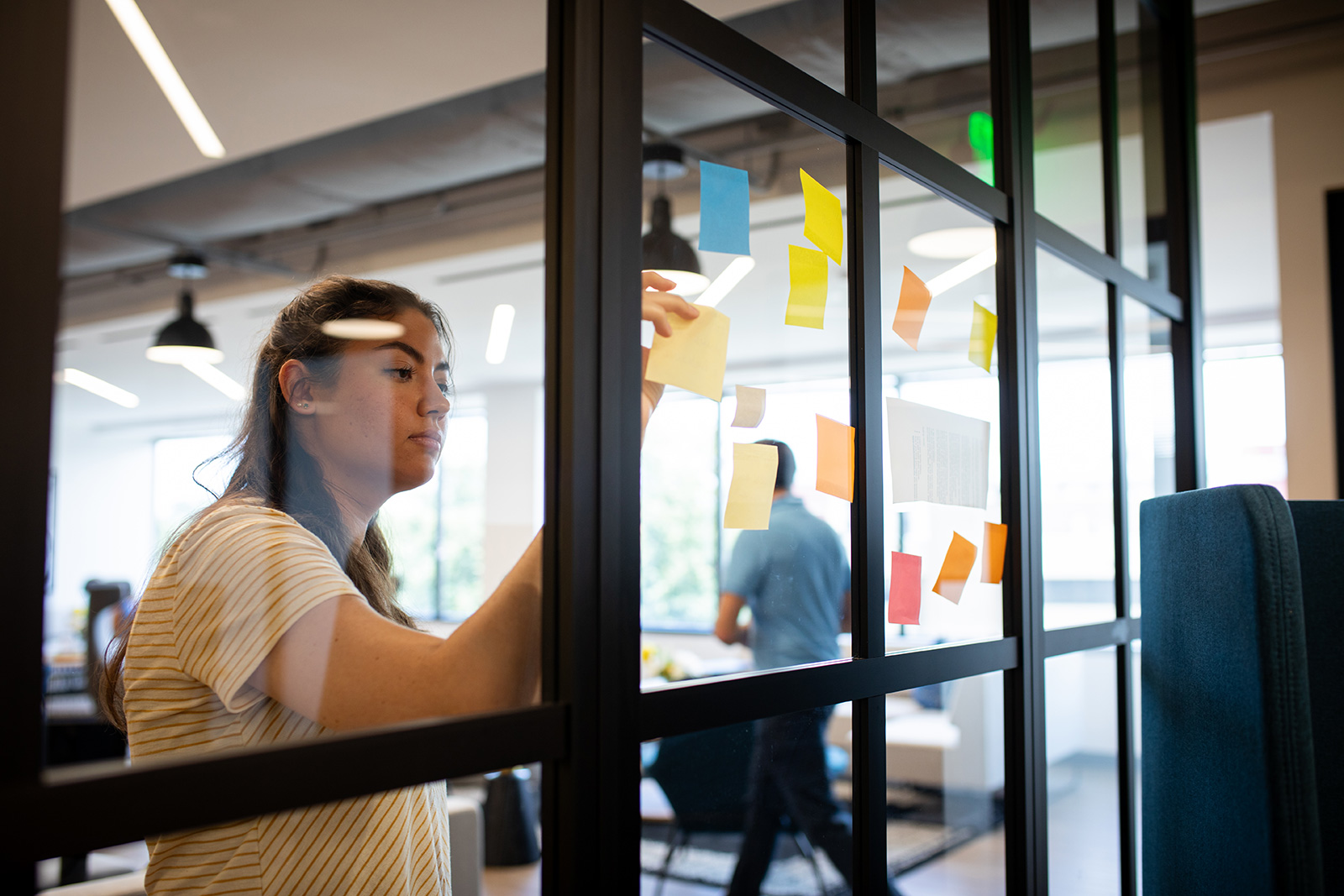 Female creative laying out strategic ideas